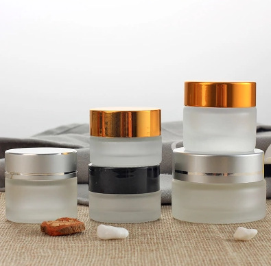 1/2 oz clear glass cylinder low-profile jar with white 40-400 neck finish Lids