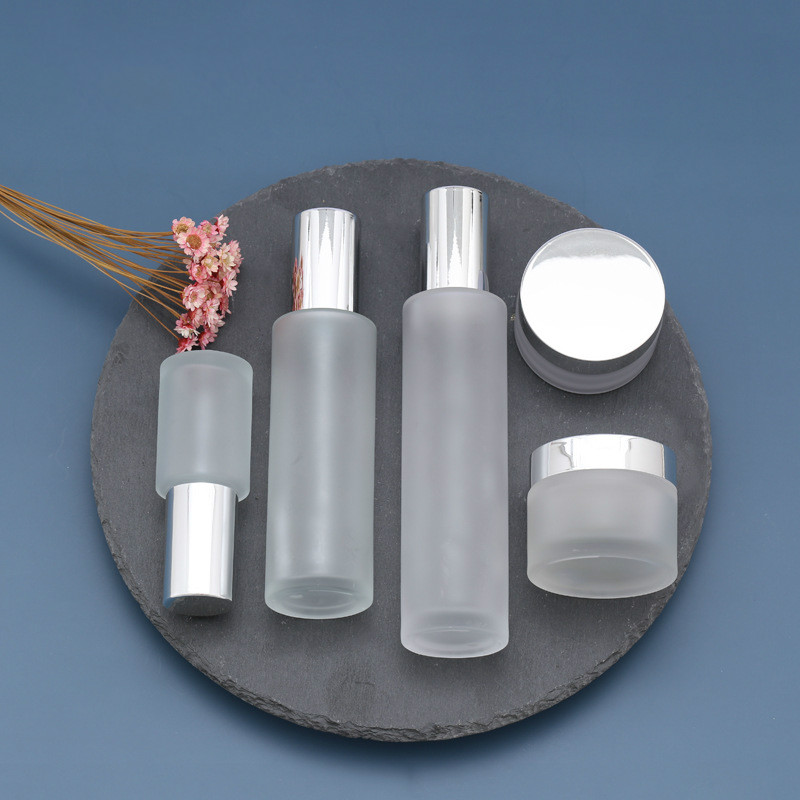 1 oz Glass Frosted Cream Jar with white Insert and Matte Silver Lid