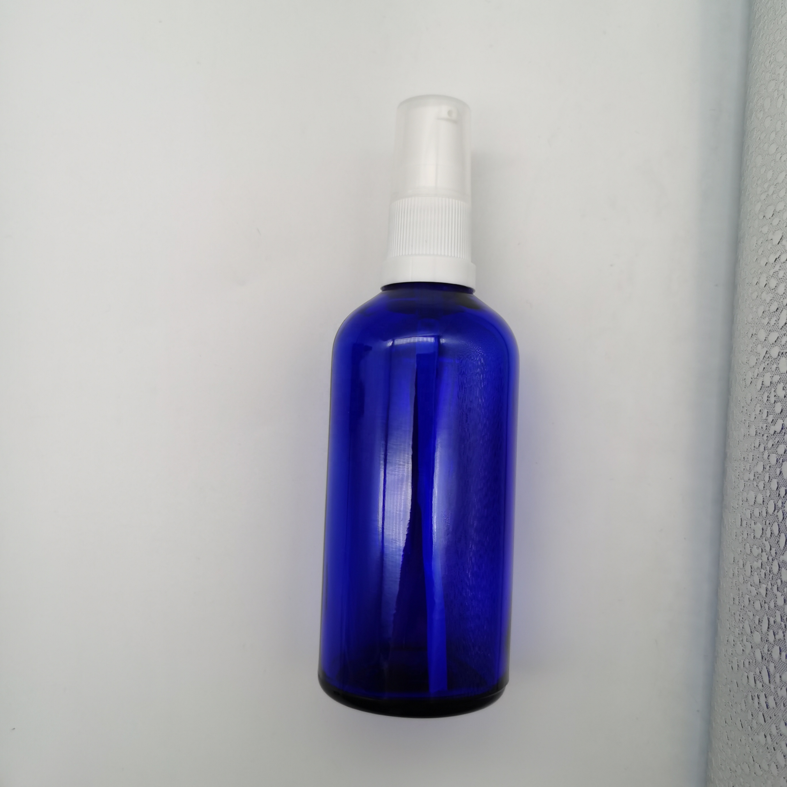 100 ml blue lotion pump glass bottle for face cream cosmetic packaging