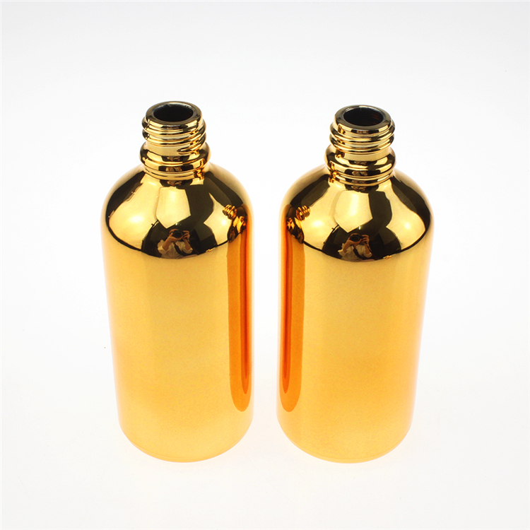 100 ml glass clear black or gold bottle with shiny gold black and silver caps