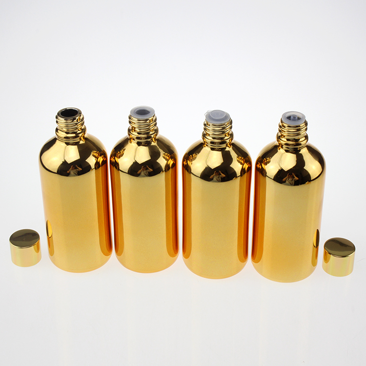 100 ml glass clear black or gold bottle with shiny gold black and silver caps