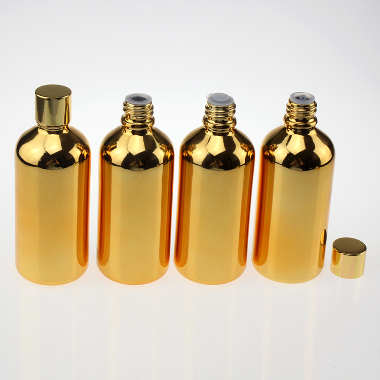 100 ml glass clear black or gold bottle with shiny gold black and silver caps