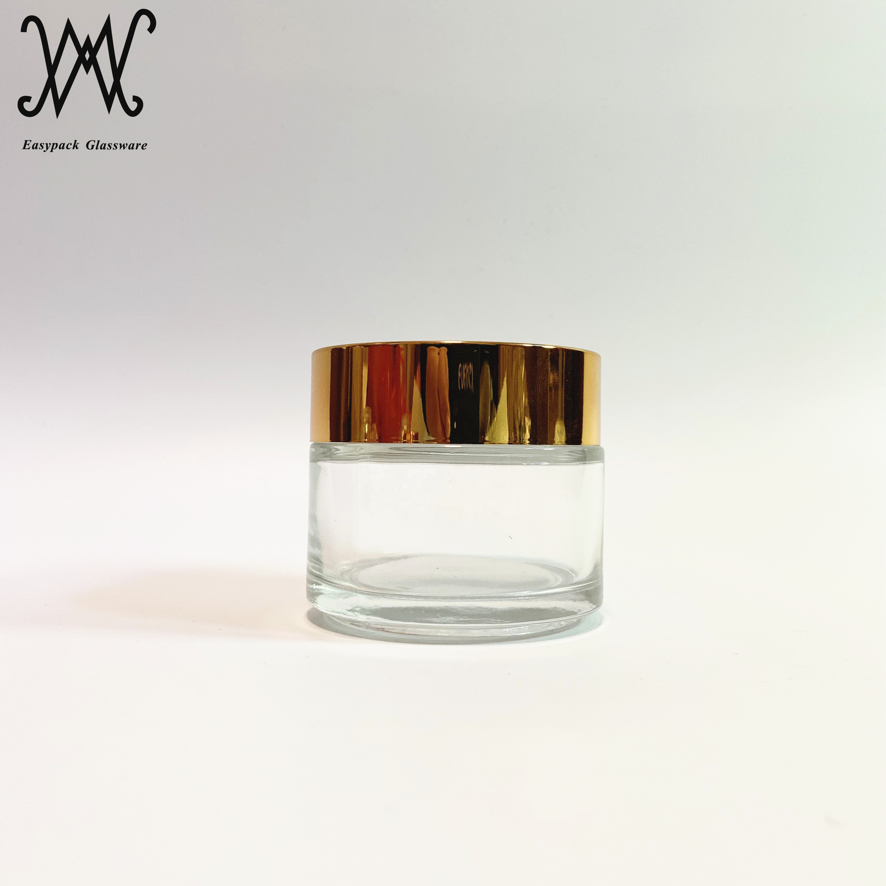100g 100ml clear glass cosmetic packaging jar with gold metal lid for cream oil