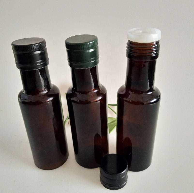100ml amber color Dorica round glass oil bottle with metal cap