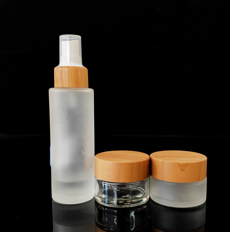 100ml clear frosted cosmetic bottle with pump bamboo cap