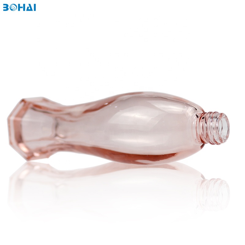 100ml clear pink glass serum bottle with lotion pump flower cap