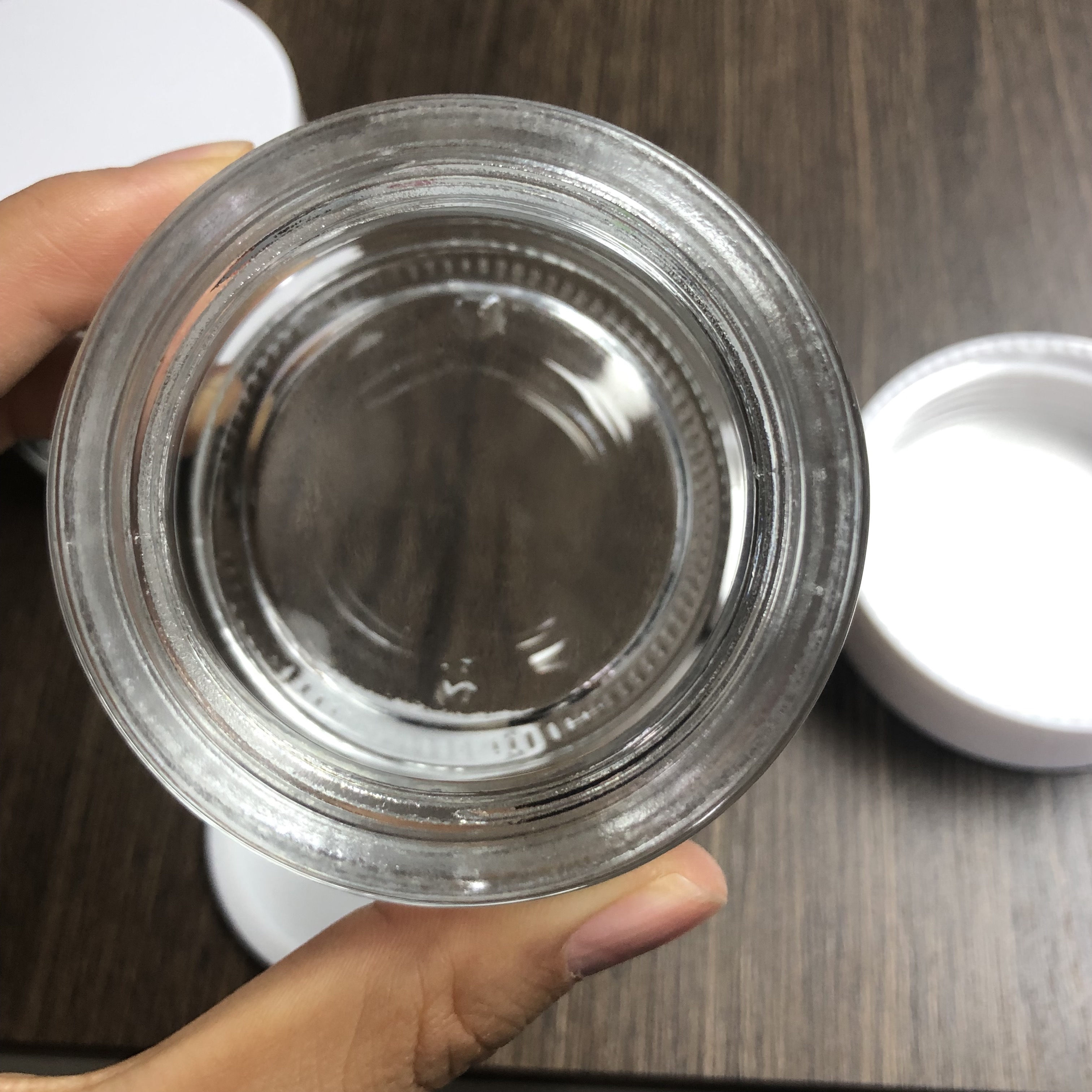 100ml cream cosmetic glass jar with glossy white smooth PP cap and inner tape