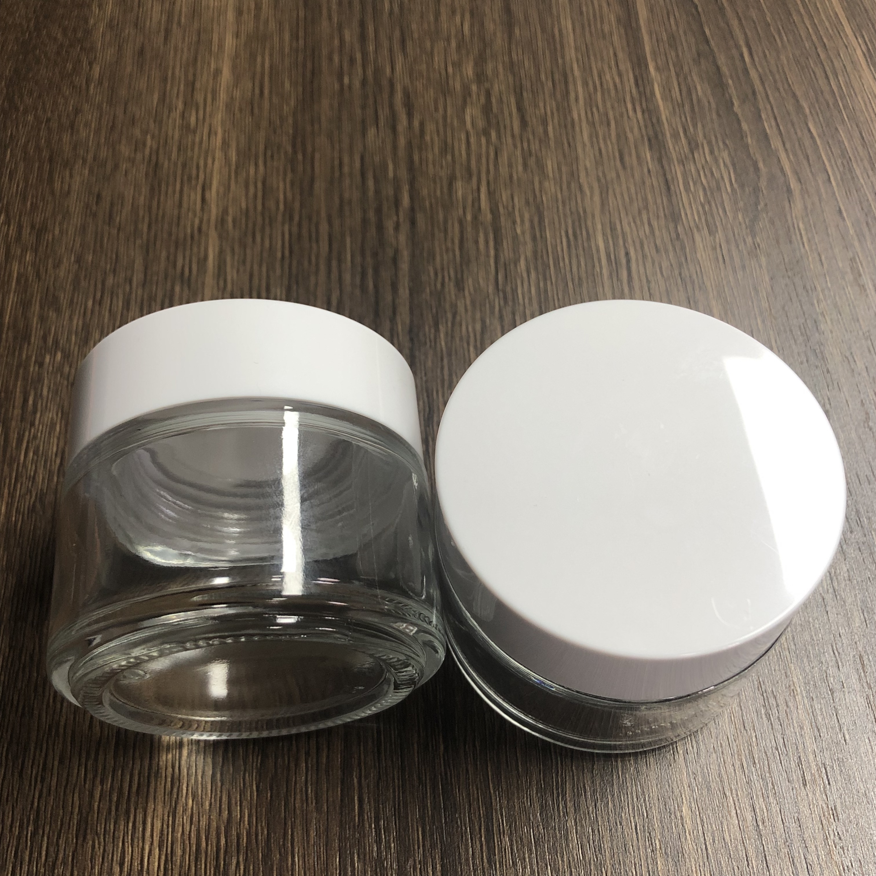100ml cream cosmetic glass jar with glossy white smooth PP cap and inner tape