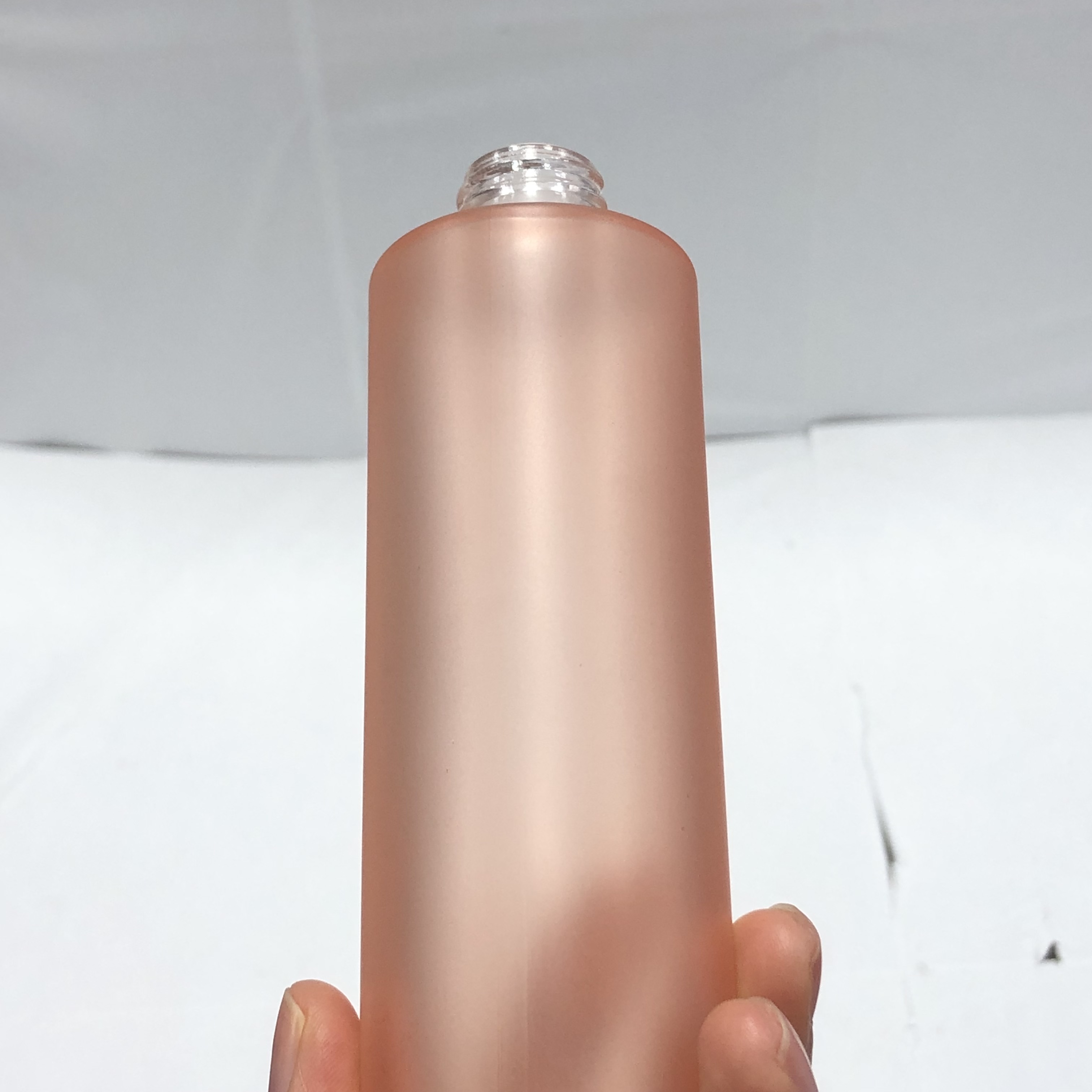100ml orange color cosmetic round glass bottle with inner reducer and plastic screw cap