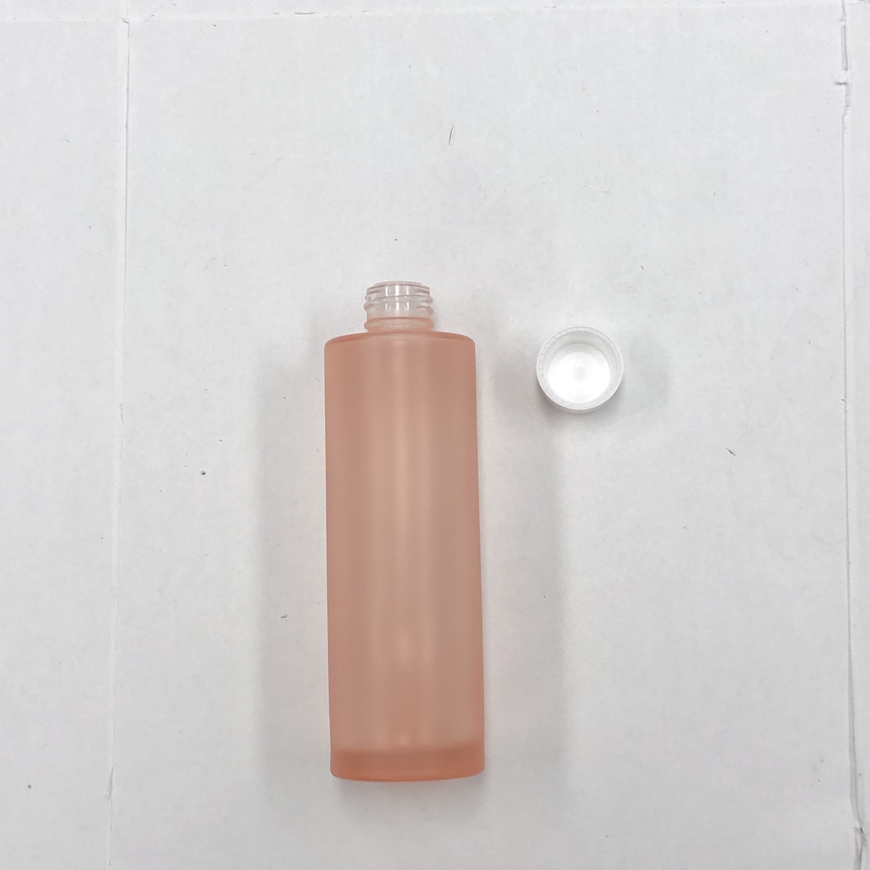 100ml orange color cosmetic round glass bottle with inner reducer and plastic screw cap