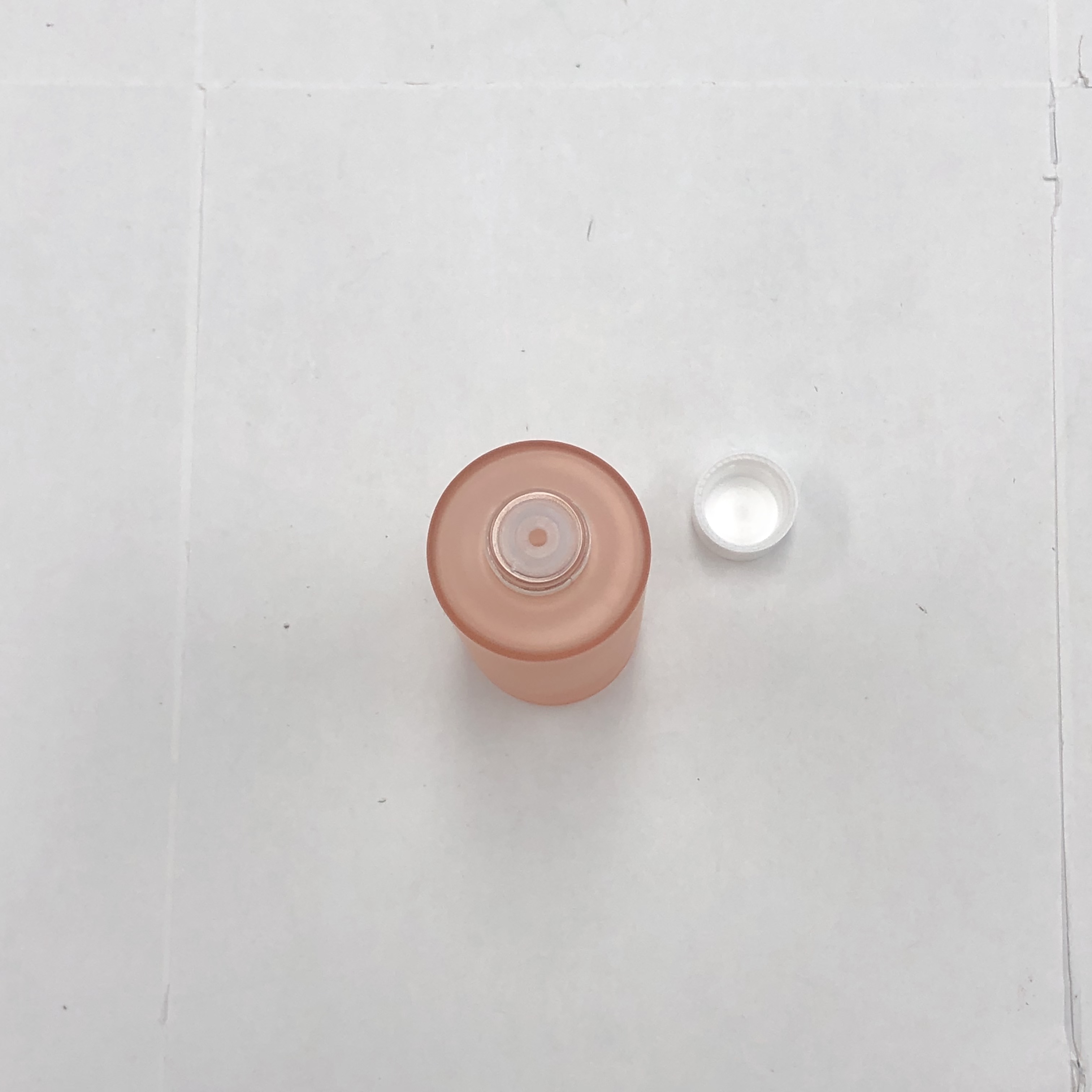 100ml orange color cosmetic round glass bottle with inner reducer and plastic screw cap