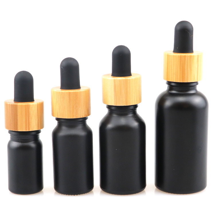 10ml 30ml 50ml cosmetic packaging essential oil dropper bottle glass bottles with wooden cap  black glass bottle