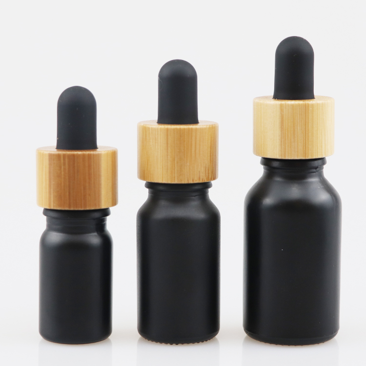 10ml 30ml 50ml cosmetic packaging essential oil dropper bottle glass bottles with wooden cap black glass bottle