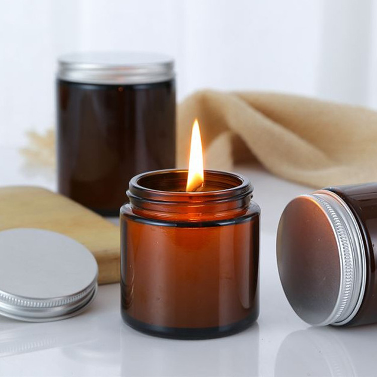 13 oz scented colorful candle in glass jar with rose gold lid