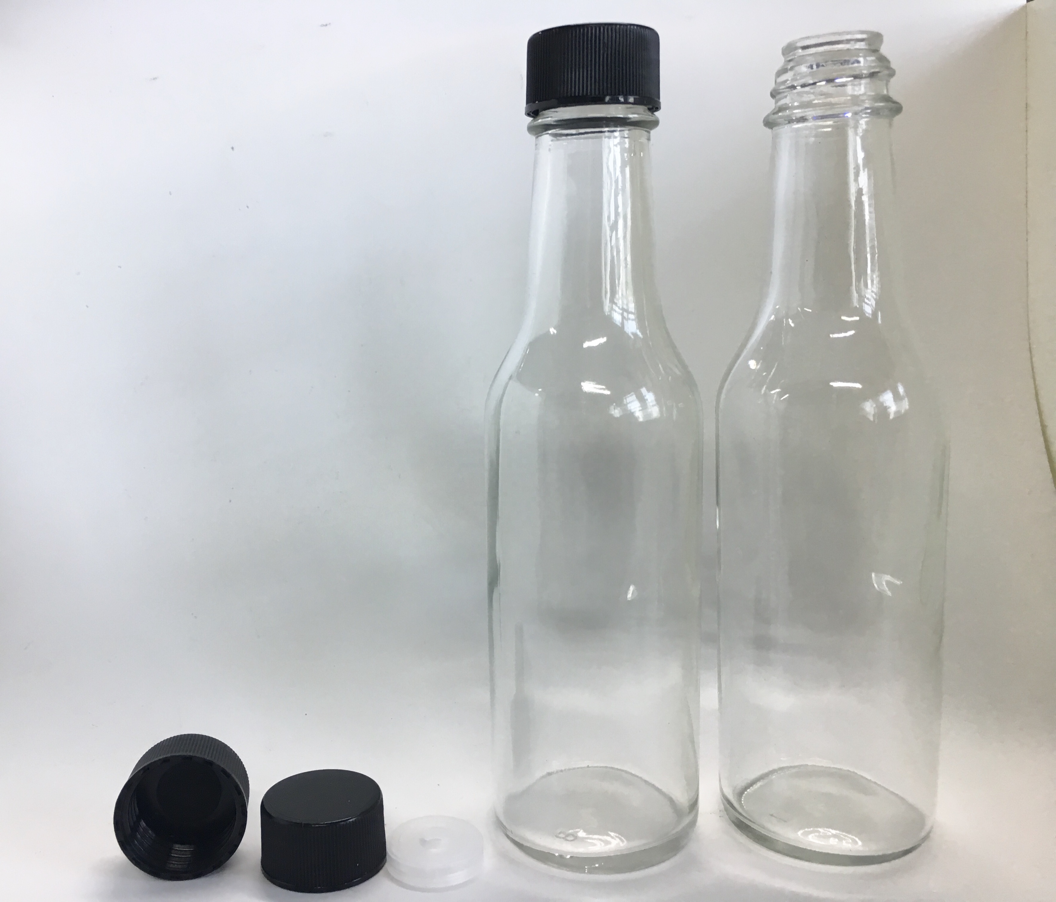 150ml 5oz clear glass sauce woozy bottle with 24-414 black screw cap and insert