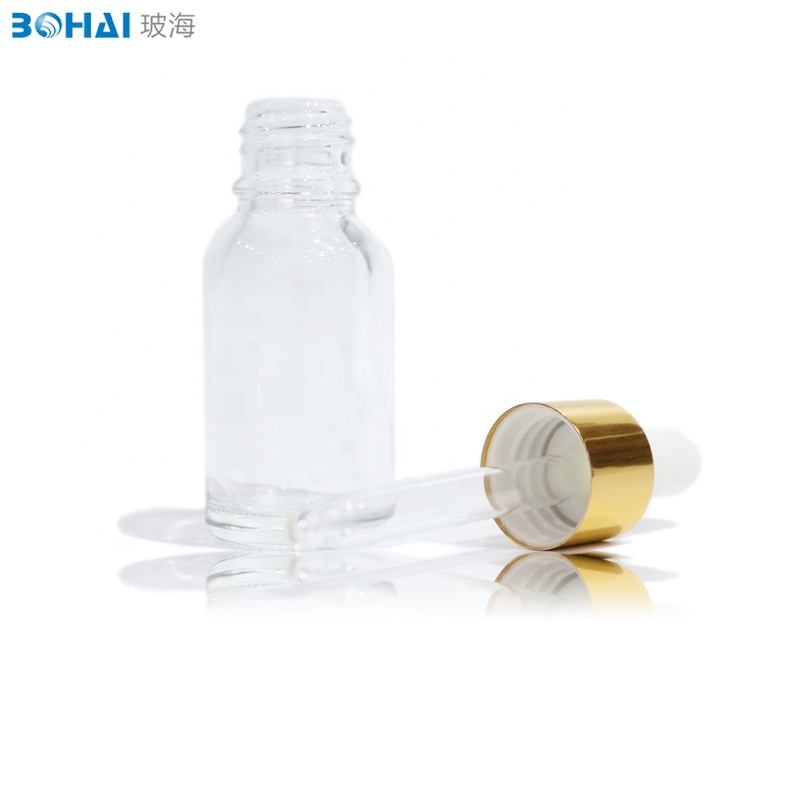 15ml 30ml 50ml 100ml clear amber boston round glass dropper bottle with white rubber gold cap of skincare packaging