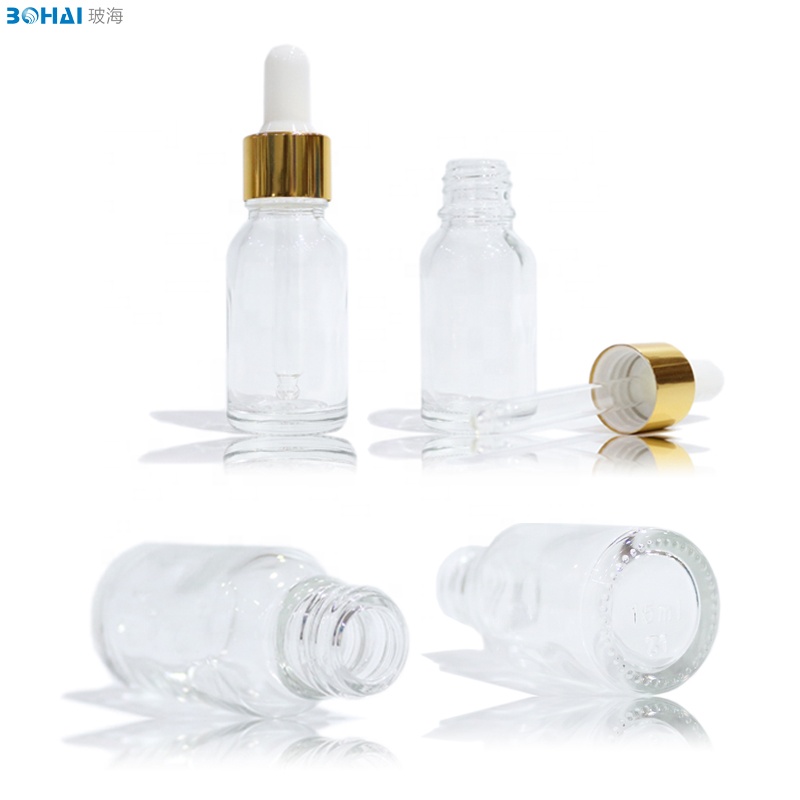 15ml 30ml 50ml 100ml clear amber boston round glass dropper bottle with white rubber gold cap of skincare packaging