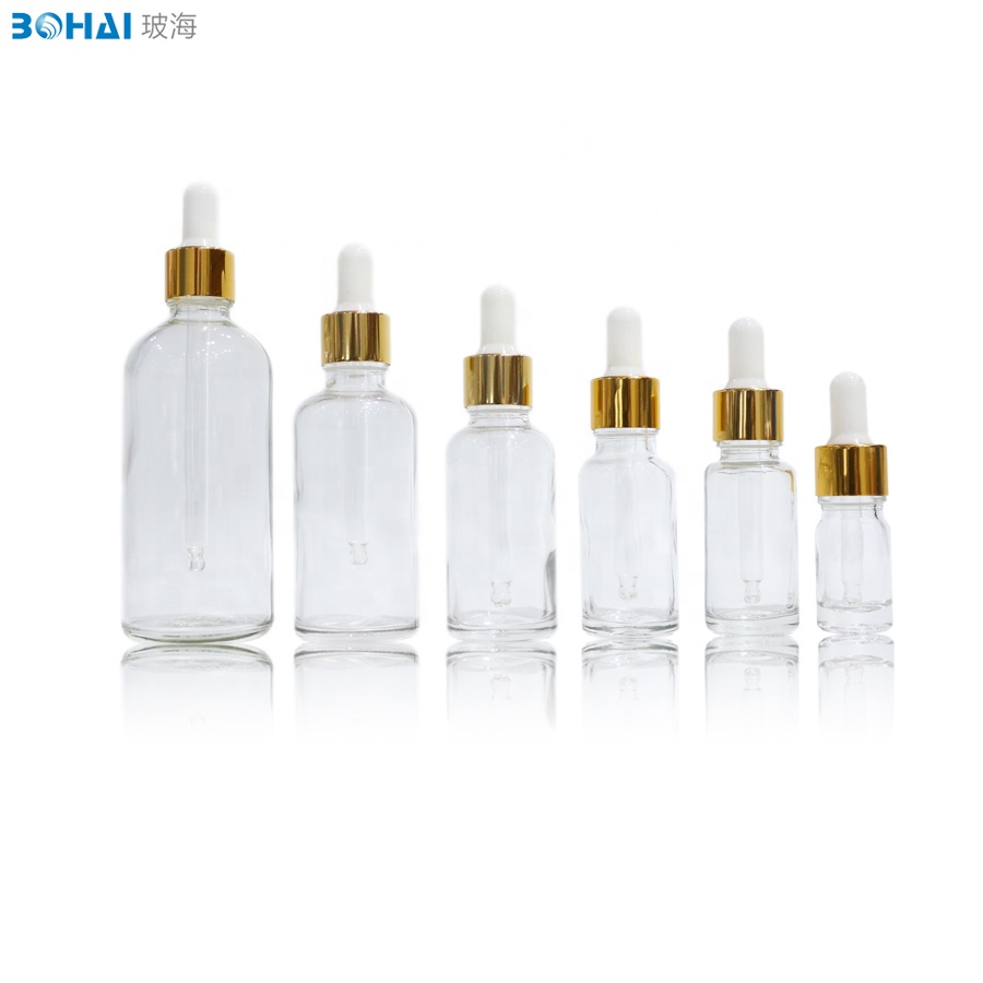 15ml 30ml 50ml 100ml clear amber boston round glass dropper bottle with white rubber gold cap of skincare packaging