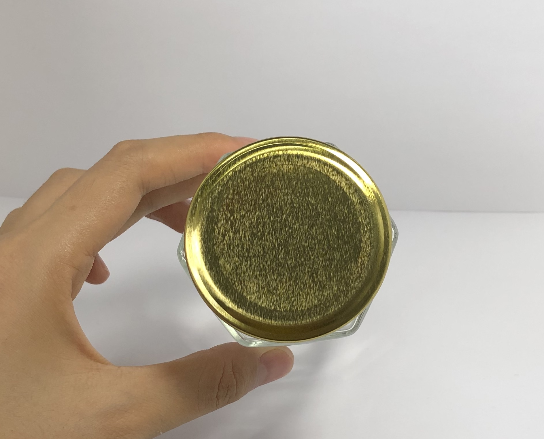 180ml clear hexagonal glass jar with golden metal screw cap
