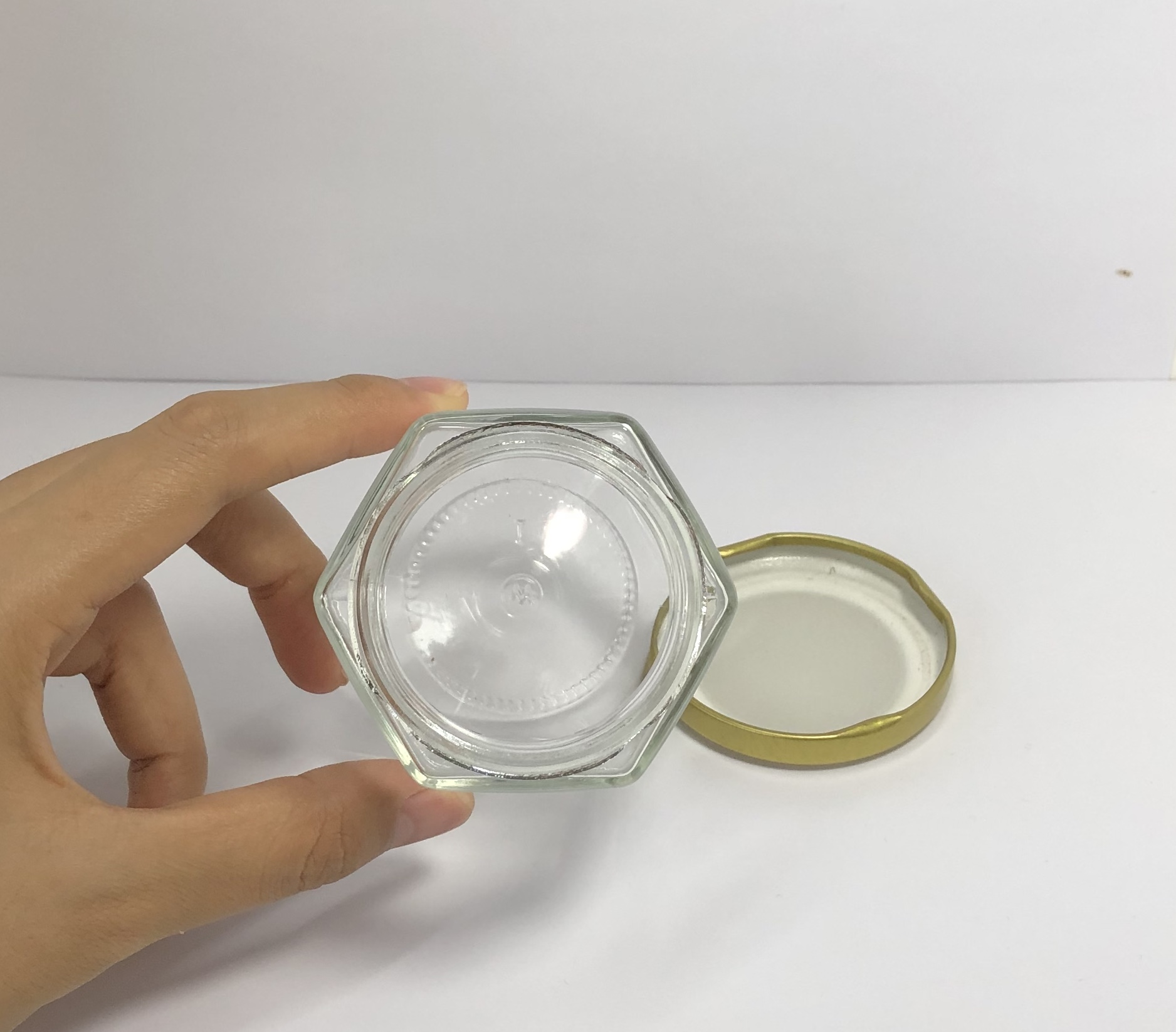 180ml clear hexagonal glass jar with golden metal screw cap