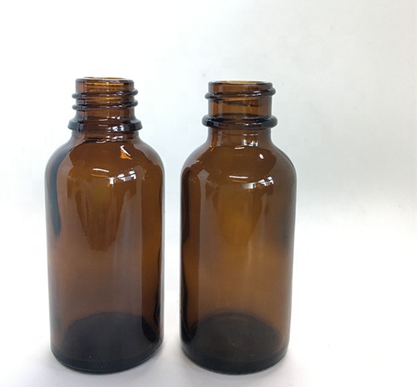 1oz 30ml amber boston round glass bottle with children resistant dropper cap for cosmetic packaging