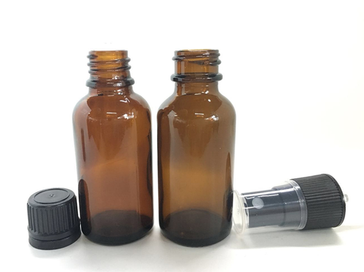 1oz 30ml amber boston round glass bottle with children resistant dropper cap for cosmetic packaging