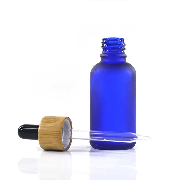 1oz 30ml clear amber blue green frosted glass dropper oil bottle with Beautiful natural bamboo cap wholesale