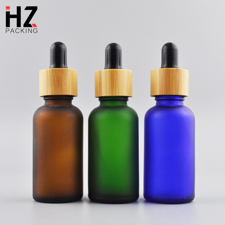 1oz 30ml round frosted black amber glass oil dropper bottles with bamboo lid