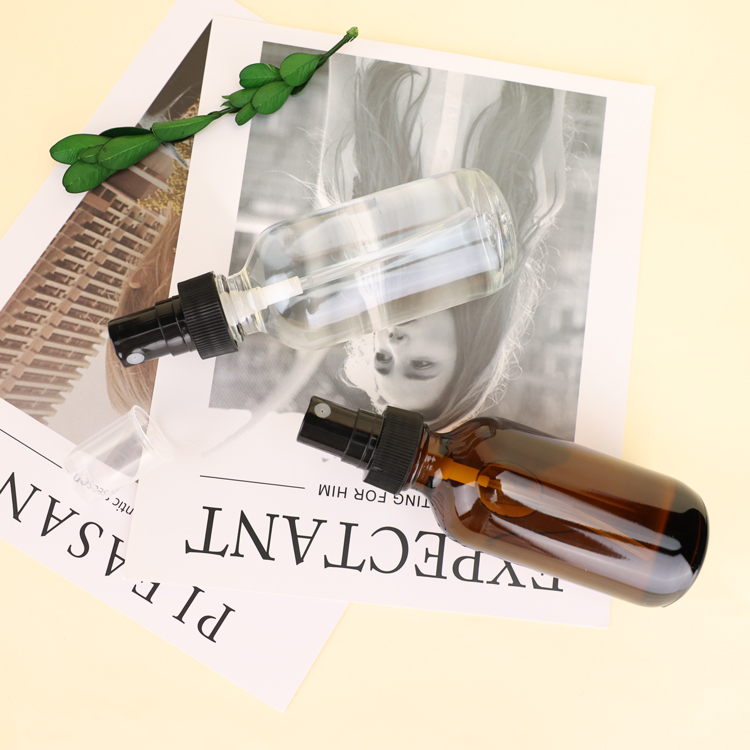 1oz Boston Round Glass Shaded Blue Bottles With Black Spray Tops