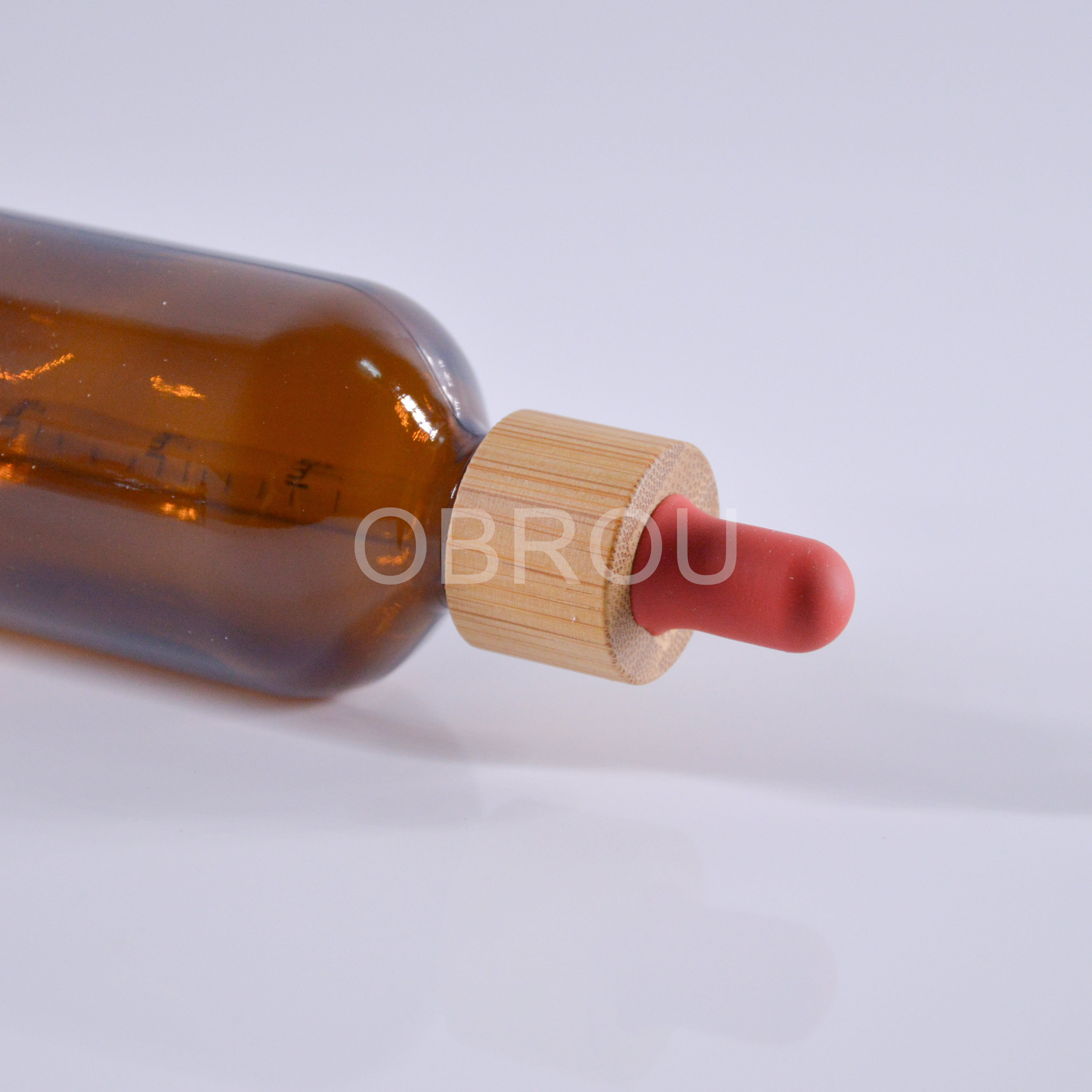 1oz amber glass essential oil dropper bottle with glass scale pipette and bamboo cap red teat