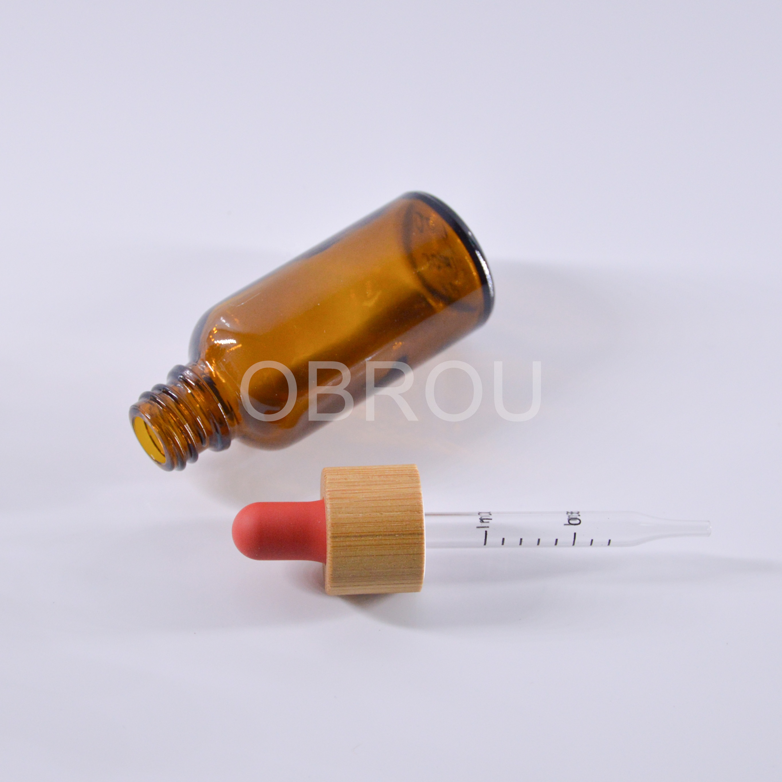 1oz amber glass essential oil dropper bottle with glass scale pipette and bamboo cap red teat