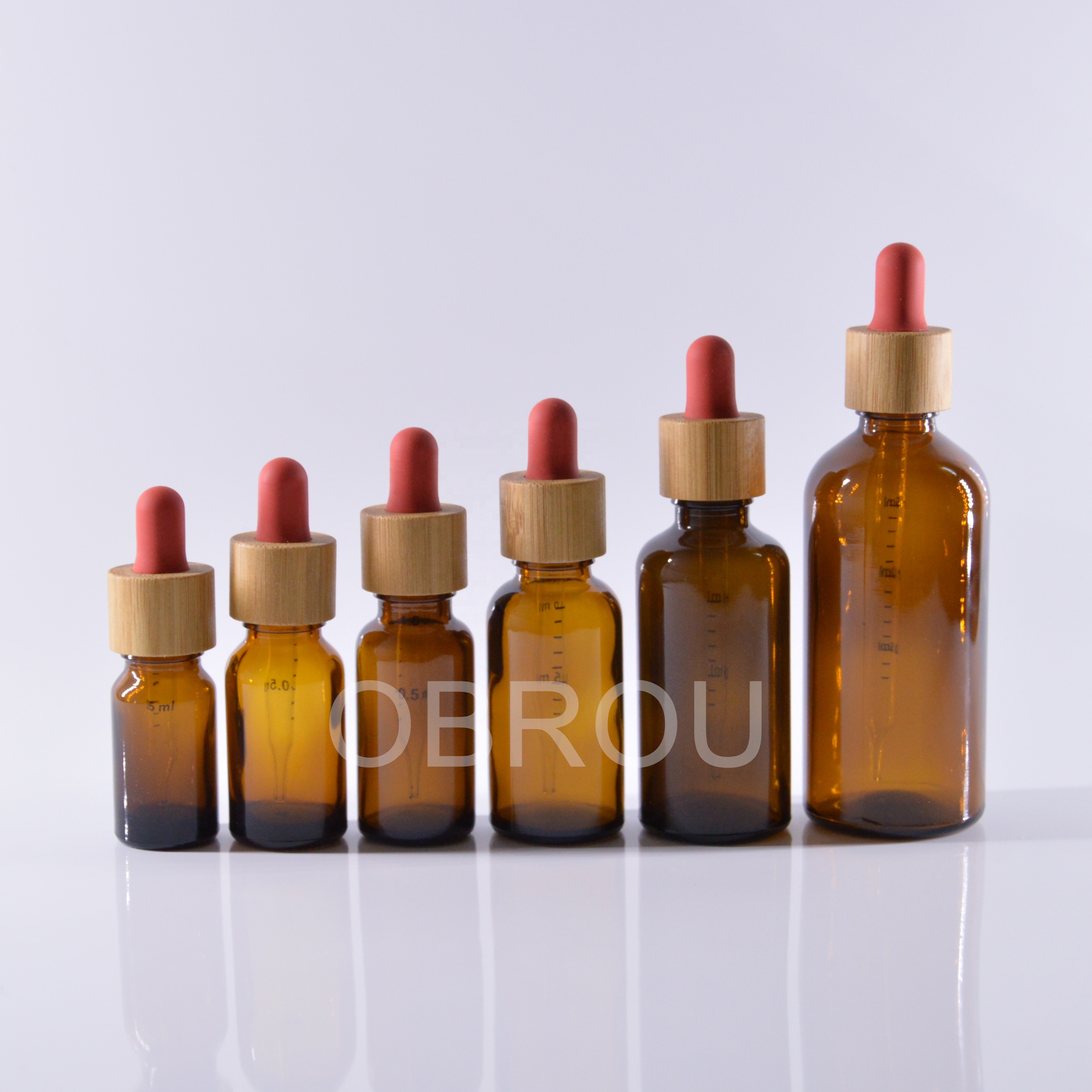 1oz amber glass essential oil dropper bottle with glass scale pipette and bamboo cap red teat