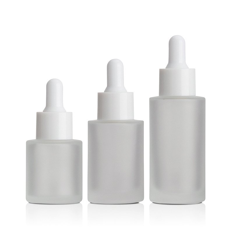 1oz flat shoulder clear glass dropper bottle with black lid for cosmetic packaging