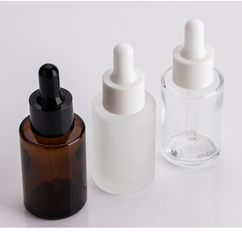1oz flat shoulder clear glass dropper bottle with black lid for cosmetic packaging