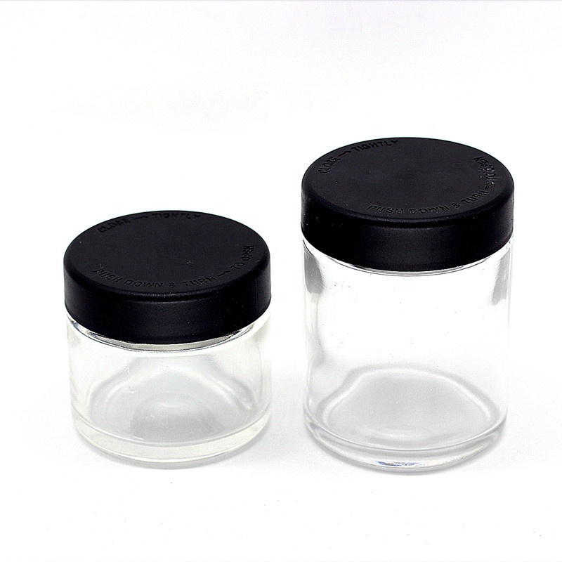 2 oz 60ml round straight side transparent glass jar with black child resistant lids