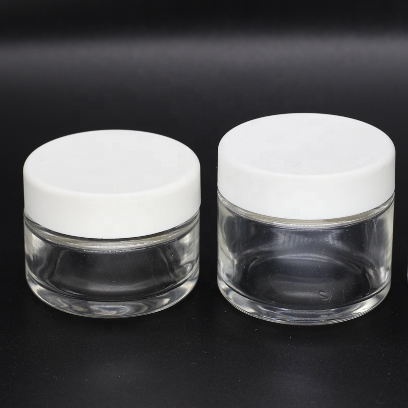 2 oz 60ml round straight side transparent glass jar with black child resistant lids