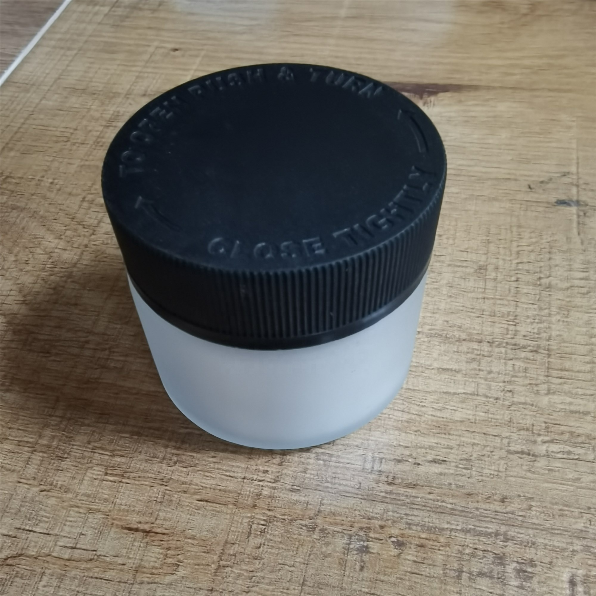 2 oz Frosted Child Resistant Glass Jar with Black Lids - Weed Flower Container
