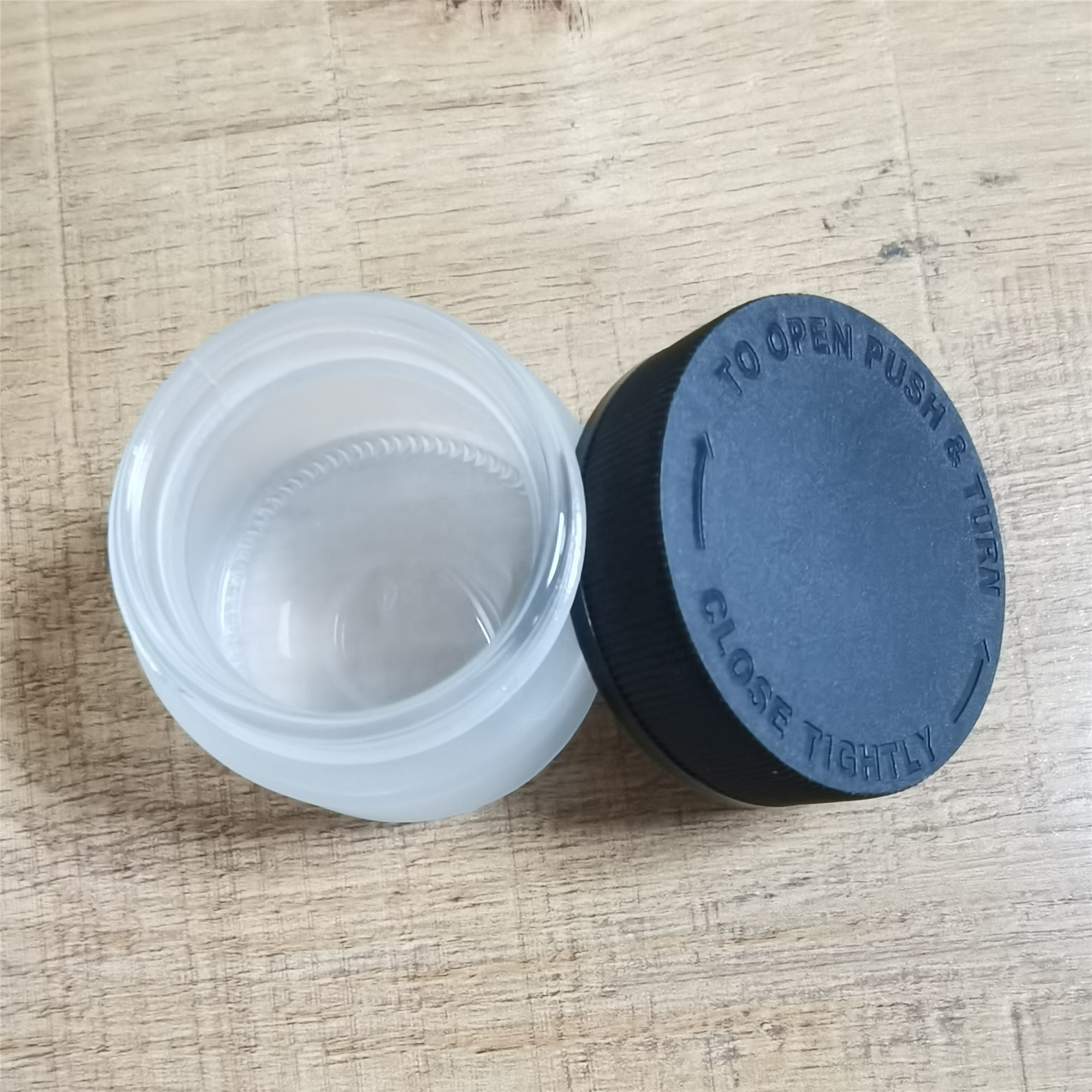 2 oz Frosted Child Resistant Glass Jar with Black Lids - Weed Flower Container