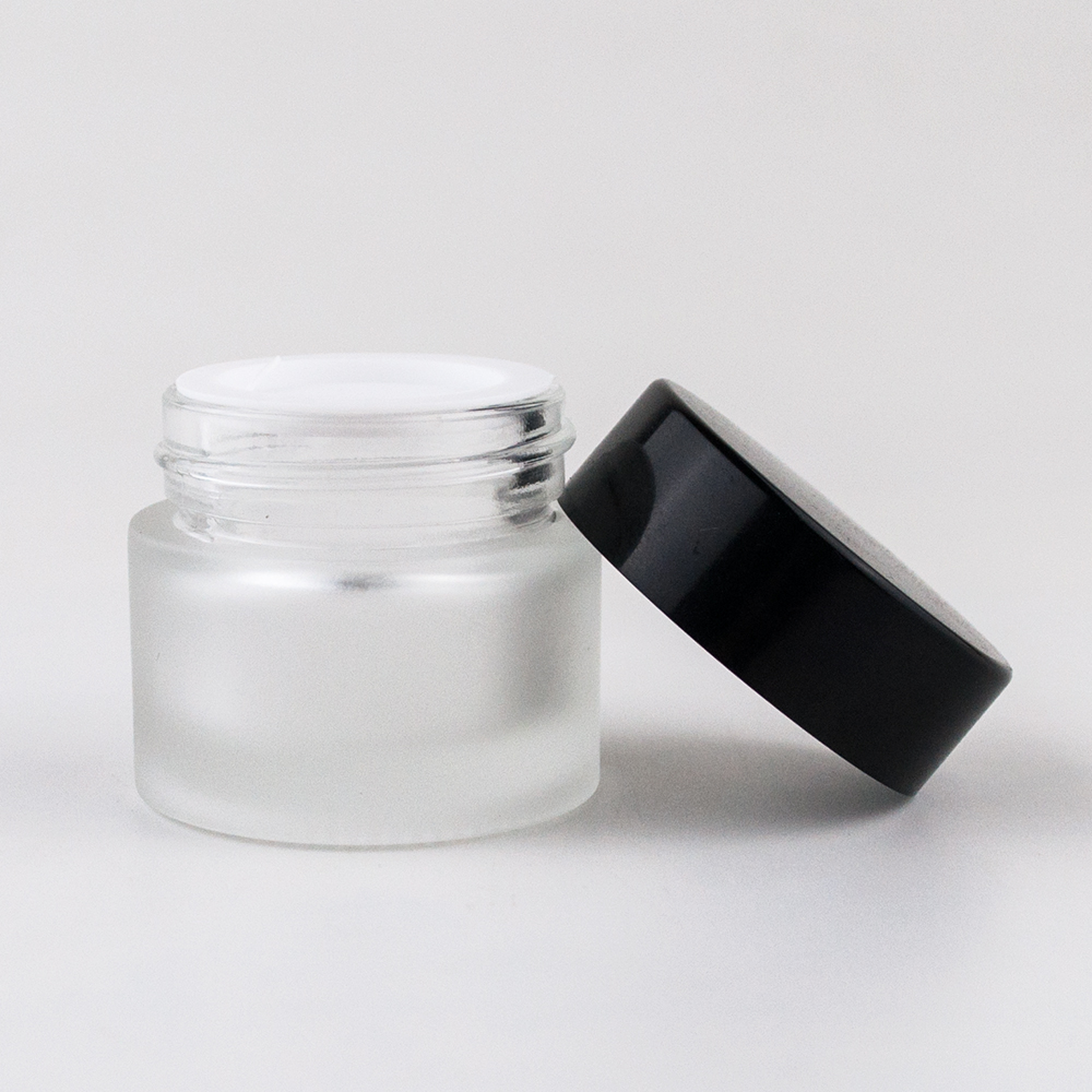 2 oz frosted clear glass cosmetic cream jar with black plastic caps