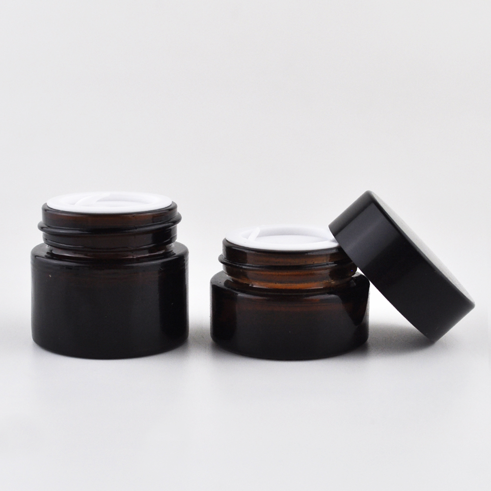 2 oz frosted clear glass cosmetic cream jar with black plastic caps