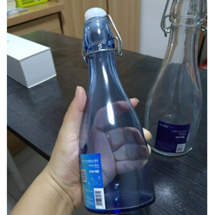 2019 best selling cheap stocked flip top cooking oil round glass bottle swing top 250ml 500ml 750ml 1000ml for juice milk