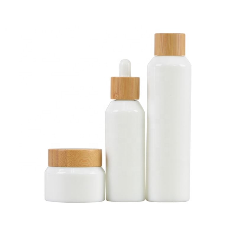 2020 New developed opal white glass cosmetic bamboo bottle with bamboo cap glass bamboo lid bottle