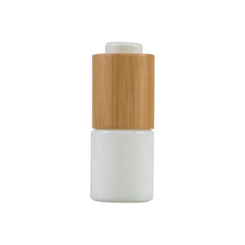 2020 New developed opal white glass cosmetic bamboo bottle with bamboo cap glass bamboo lid bottle