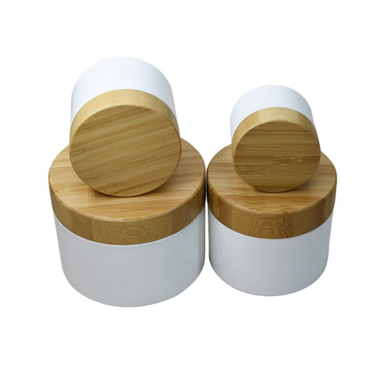 2020 year hot sales 15g 30g 50g 100g frosted clear glass jar with bamboo wooden lid