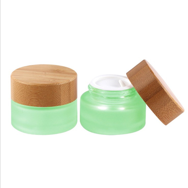2020 year hot sales 15g 30g 50g 100g frosted clear glass jar with bamboo wooden lid