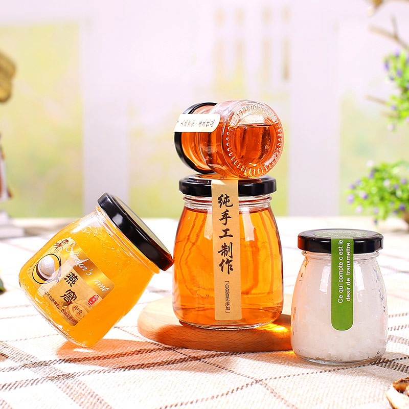 2021 Cheap 50ml 100ml food container yogurt milk clear glass bottles storage pudding jar with plastic lid metal lids
