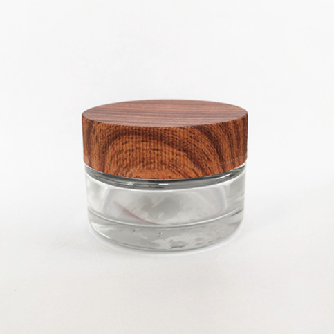 2021 Refillable 2oz 4oz empty round black cbd flower container storage weed glass jar with child proof cap