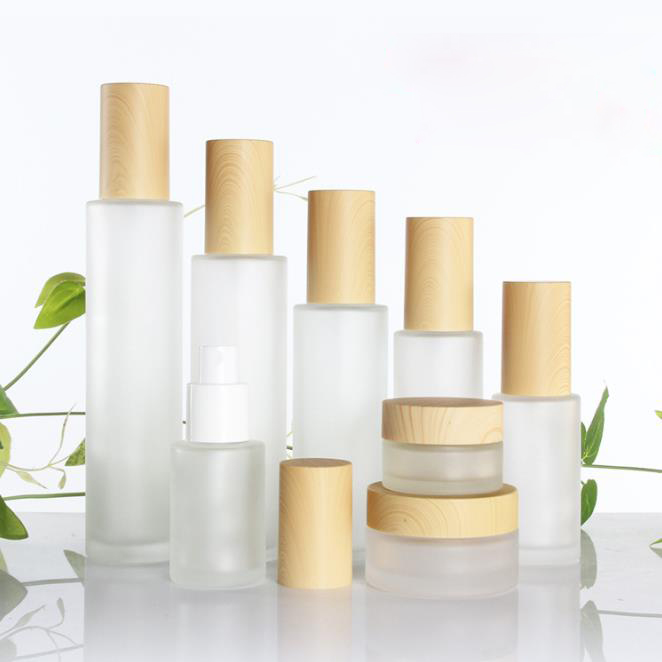 20g 30g 50g clear frosted glass skincare cream jars 40ml-120ml lotion pump bottles with wood grain cap bamboo lid