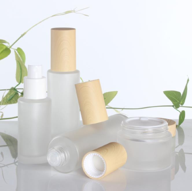 20g 30g 50g clear frosted glass skincare cream jars 40ml-120ml lotion pump bottles with wood grain cap bamboo lid
