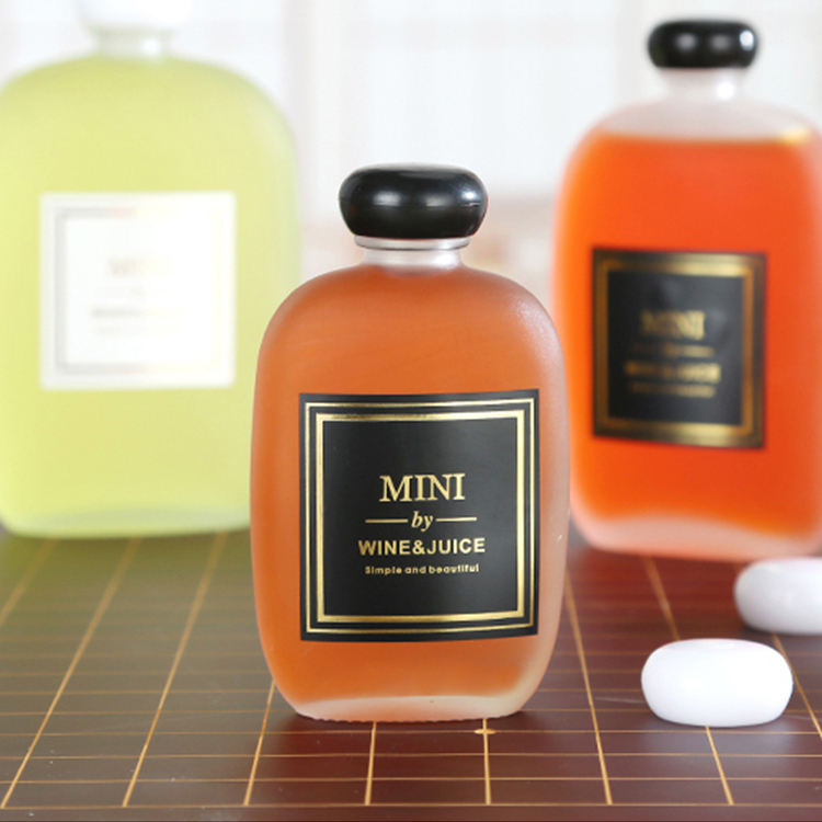 250ml Cheap Cute Flat Round Eco Friendly Clear cold pressed Glass Juice drinks Bottle
